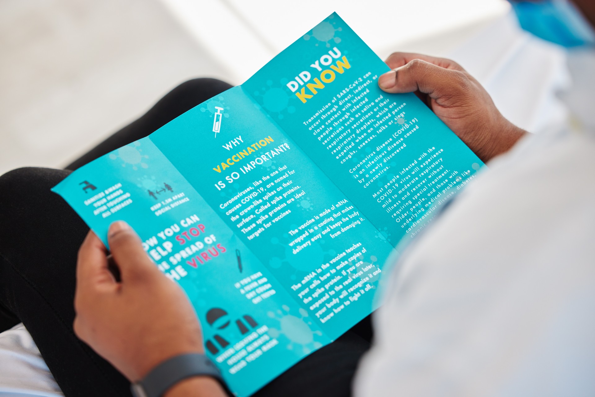 brochure and person reading information on a virus for safety, security and protection. Healthcare, advice and patient with knowledge of vaccination on document from clinic with instructions